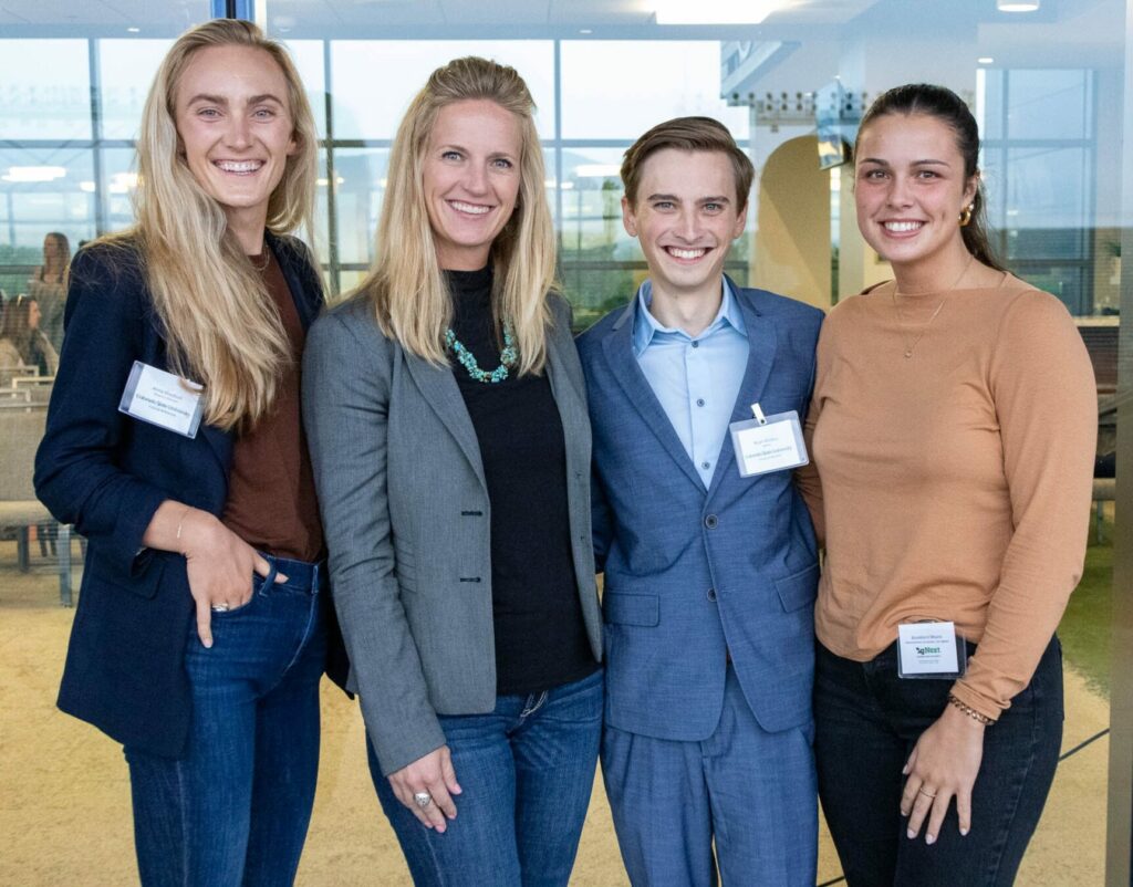 Anna Shadbolt, Dr. Kim Stackhouse-Lawson, Noah Winters, and Brooklynn Moore pose in a group at an agriculture industry event